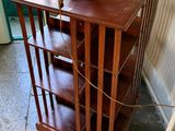 a small wooden table with a lamp on top of it