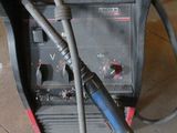 a welding machine that is sitting in the garage