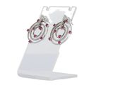 pair of pink and white diamond earrings on a display stand