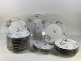 a lot of plates that are sitting on a table