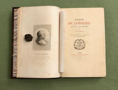 un livre sur lequel figure la photo d'un homme portant un chapeau