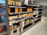 a lot of food on the shelves in the store