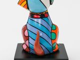 sculpture of a colorful dog sitting on a black base