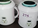 two blenders sitting next to each other on a table