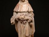 an image of a statue of a woman holding a flower