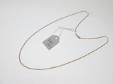 gros plan d'un collier auquel est attachée une étiquette