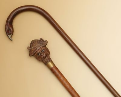 2 CANNES - L'une en bois avec pommeau sculpté d'une tête de … - Photo 1