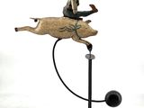 a statue of a man riding a horse with a hat on