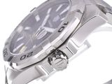 a close up of a watch on a metal bracelet