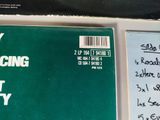 a green book with writing on it sitting on a table