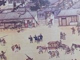 a painting of a village with a lot of people on it