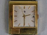 an image of a gold plated watch with a black leather strap