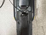 an overhead view of a speaker with a cord connected to it