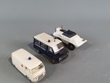 two toy cars that are sitting next to each other on a table
