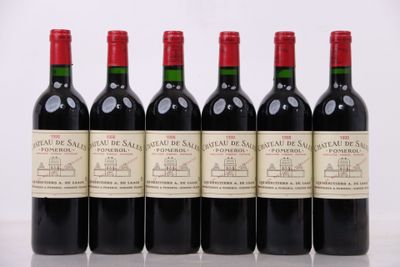 six bouteilles de vin rouge alignées sur une table