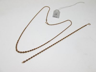 a close up of a necklace and a tag on a table