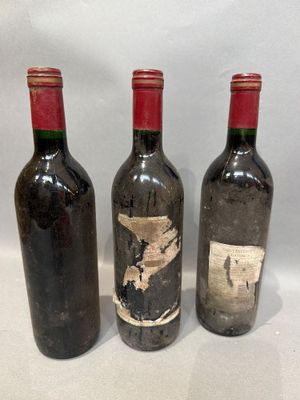 three bottles of wine sitting next to each other on a table