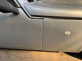 a close up of a car door with a handle on it