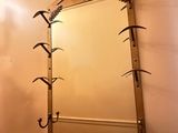 a mirror hanging on the wall in a bathroom