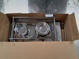 a cardboard box with two pots and pans inside of it