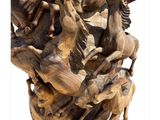 sculpture of a group of horses in a vase on a pedestal