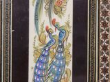 a picture of a picture of a peacock on the wall