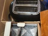 a toaster and a toaster sitting inside of a box