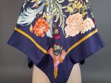 an image of a blue scarf with flowers on it