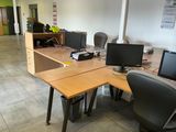 a desk with two computer monitors and a keyboard on it