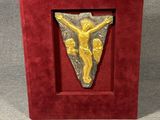 an image of a red box with a gold jesus on it