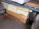 a pile of boxes sitting on a shelf in a warehouse