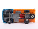 a close up of a toy car on a white surface