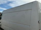 a white van parked on the side of the road