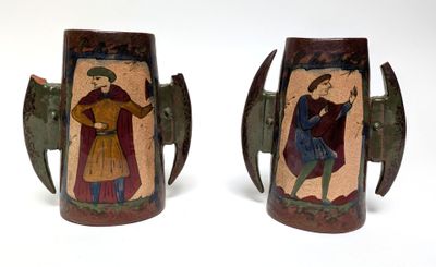 pair of art decoupholated vases with figures on them
