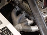 a close up of a car engine with a red knob