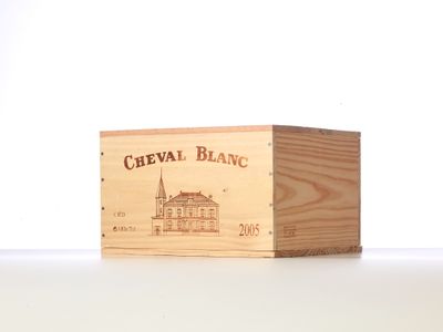 a wooden box with a drawing of a building on it