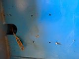 an image of a toothbrush stuck in a hole in the wall