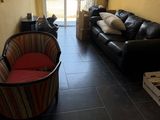 a living room with a couch and a chair in it