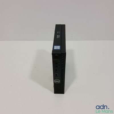 a close up of a small black computer on a white surface