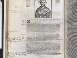 an open book with a picture of a man in a hat on top of it