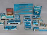 many boxes of cigarettes sitting on a white surface