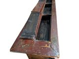 an old wooden bench with two windows on it