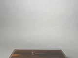 a small wooden box with a drawer on top of it
