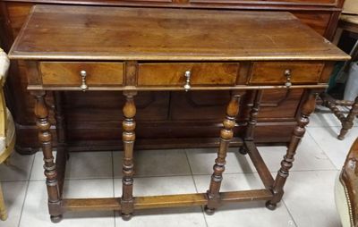 a small wooden table with a mirror on top of it