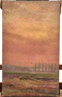 an oil painting of a landscape on a easel with a sunset in the background