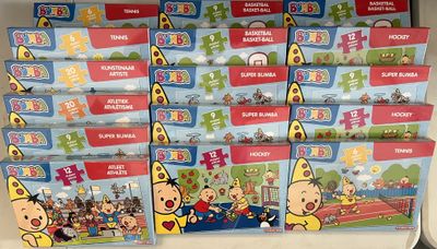 several children ' s books on a shelf in a toy store