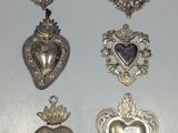 a lot of silver hearts hanging on the wall