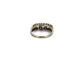 a close up of a diamond ring on a white background