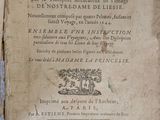 a very old book that is on the table