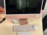 a computer on a desk with a keyboard and mouse